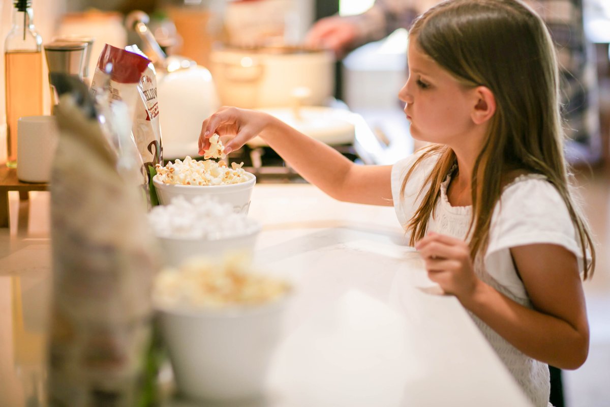 Tasting freshly popped Free Day Popcorn